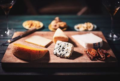 Close-up of cheese slices on chopping board