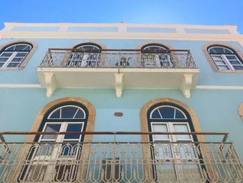 Low angle view of building against clear blue sky