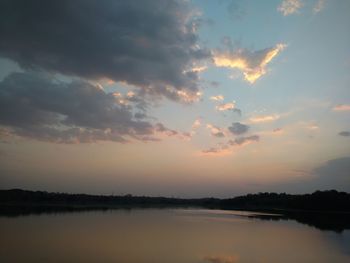 Scenic view of lake at sunset