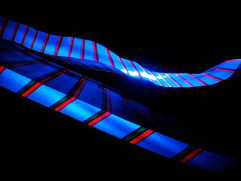 Low angle view of illuminated lights at night