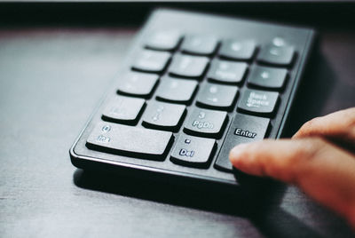 Close-up of hand using mobile phone