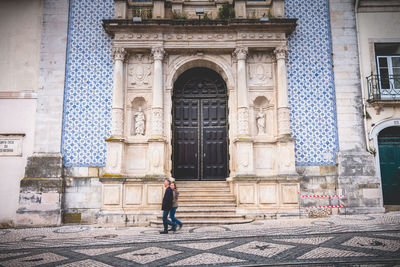 Woman walking in historic building