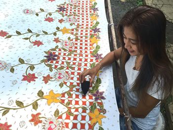 Woman printing on fabric