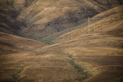 Electricty cables in arid landscape fuerteventura