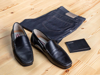 High angle view of shoes on wooden floor