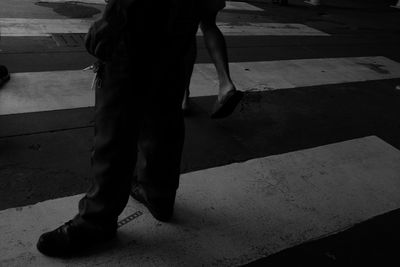 Low section of man standing on floor