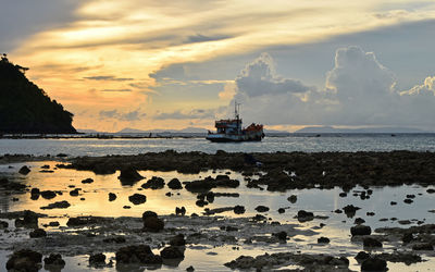 Scenic view of sea against cloudy sky