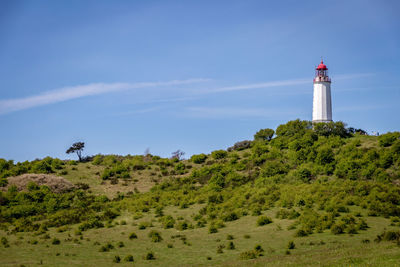Low angle view of lighthouse on landscape