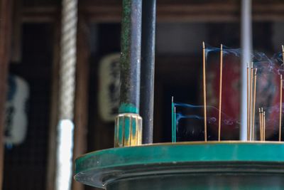 Close-up of incense burning indoors