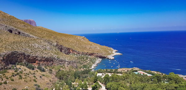 Scenic view of sea against blue sky