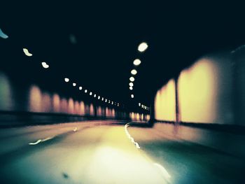 Empty illuminated street lights at night