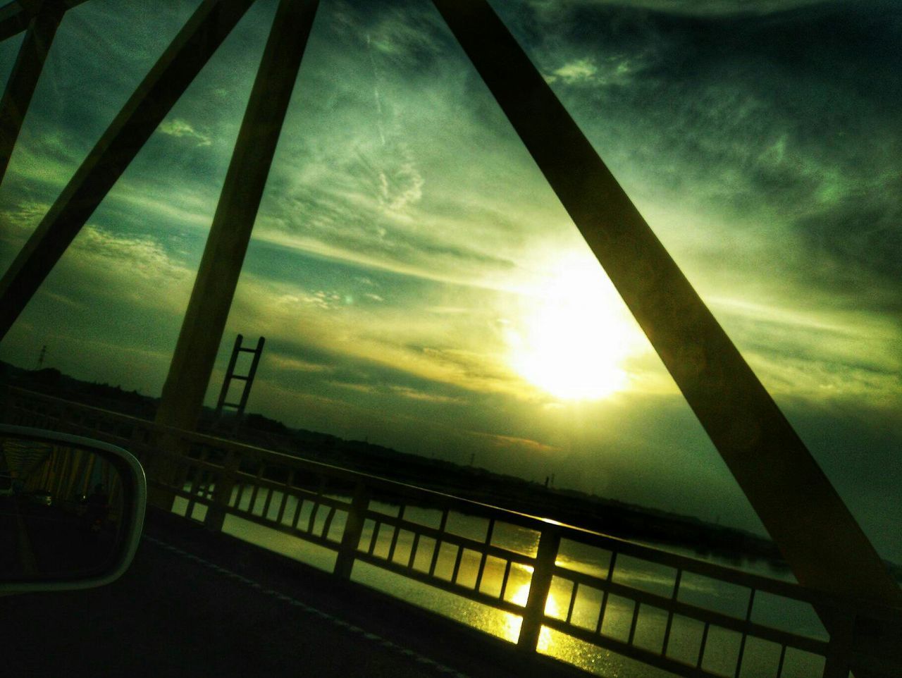 sky, cloud - sky, sunset, architecture, nature, built structure, no people, railing, sun, transportation, sunlight, bridge, outdoors, low angle view, dusk, mode of transportation, beauty in nature, scenics - nature, car, motor vehicle