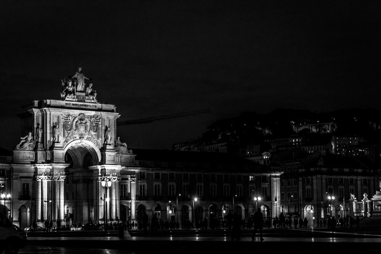 VIEW OF ILLUMINATED BUILDING AT NIGHT