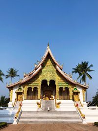 Facade of temple against clear blue sky