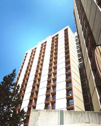 Low angle view of building against clear blue sky