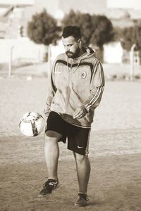 Full length of man playing on field