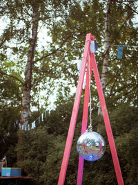 Low angle view of bubbles hanging in park