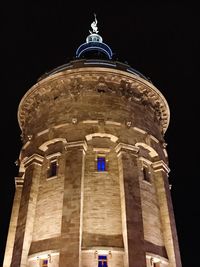 Low angle view of cathedral against sky at night