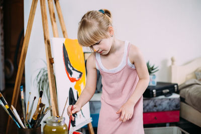 Girl painting at home