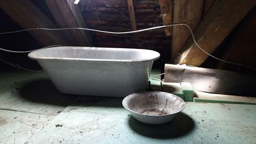 Old tea cup on table at home