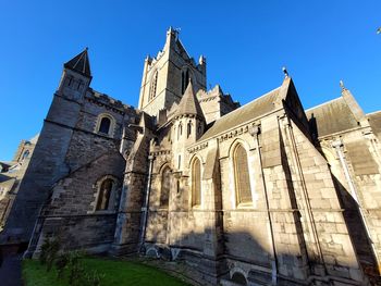 Low angle view of historic building against sky - christ church cathedral dublin