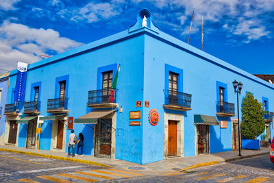 View of buildings against blue sky