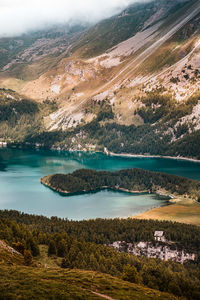 Scenic view of lake and mountains against sky