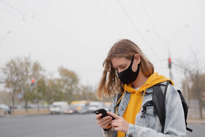 Young woman using mobile phone