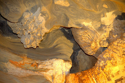 Full frame shot of cave rock in water