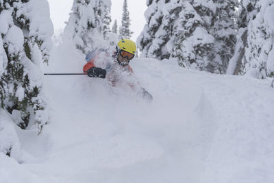 Man skiing on snowcapped mountain