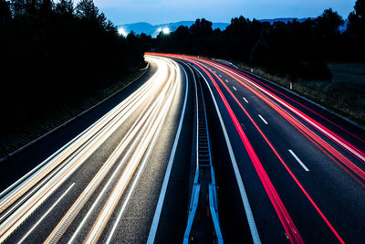 High angle view of light trails on highway at night