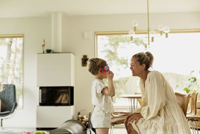 Mother with daughter in living room