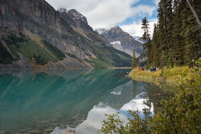 Scenic view of lake and mountains against sky