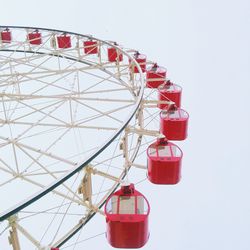 Low angle view of ferris wheel against sky