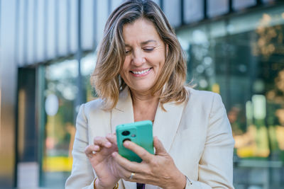 Young woman using mobile phone