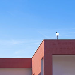 Low angle view of building against blue sky