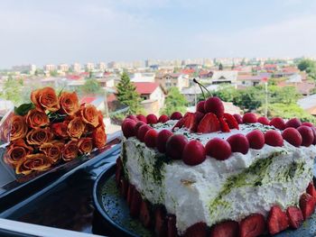 Close-up of cake with ice cream against sky