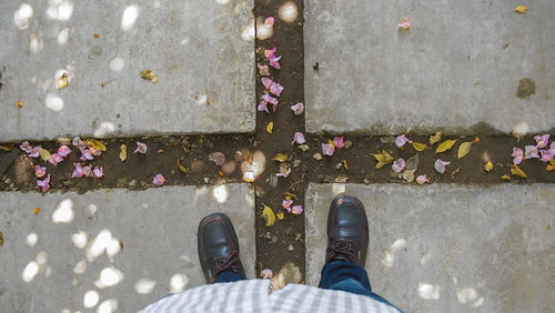 Low section of man standing on floor