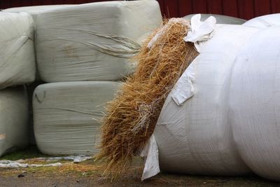 Close-up of hay bales on sofa at home