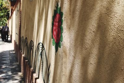 Close-up of multi colored umbrellas hanging on wall