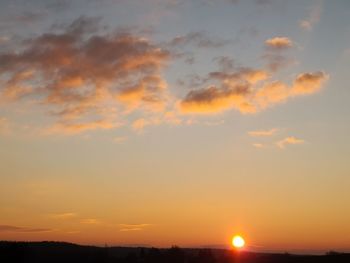 Low angle view of dramatic sky during sunset