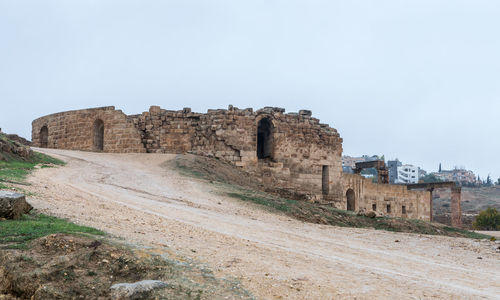 Old ruins of fort against clear sky