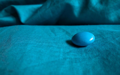 Close-up of blue ball on table
