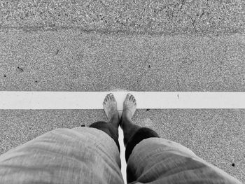 Low section of man standing on floor