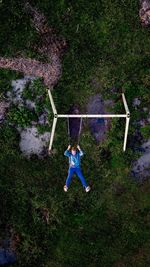 Directly above shot of man on swing at park