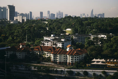 High angle view of buildings in city against sky