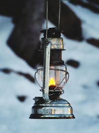 Close-up of illuminated oil lamp