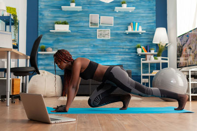 Woman exercising at home