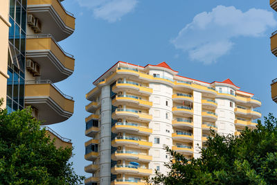 Low angle view of an apartment building with balconies. residential real estate.