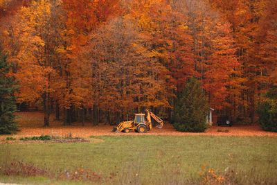 Mid distance of excavator on field during autumn